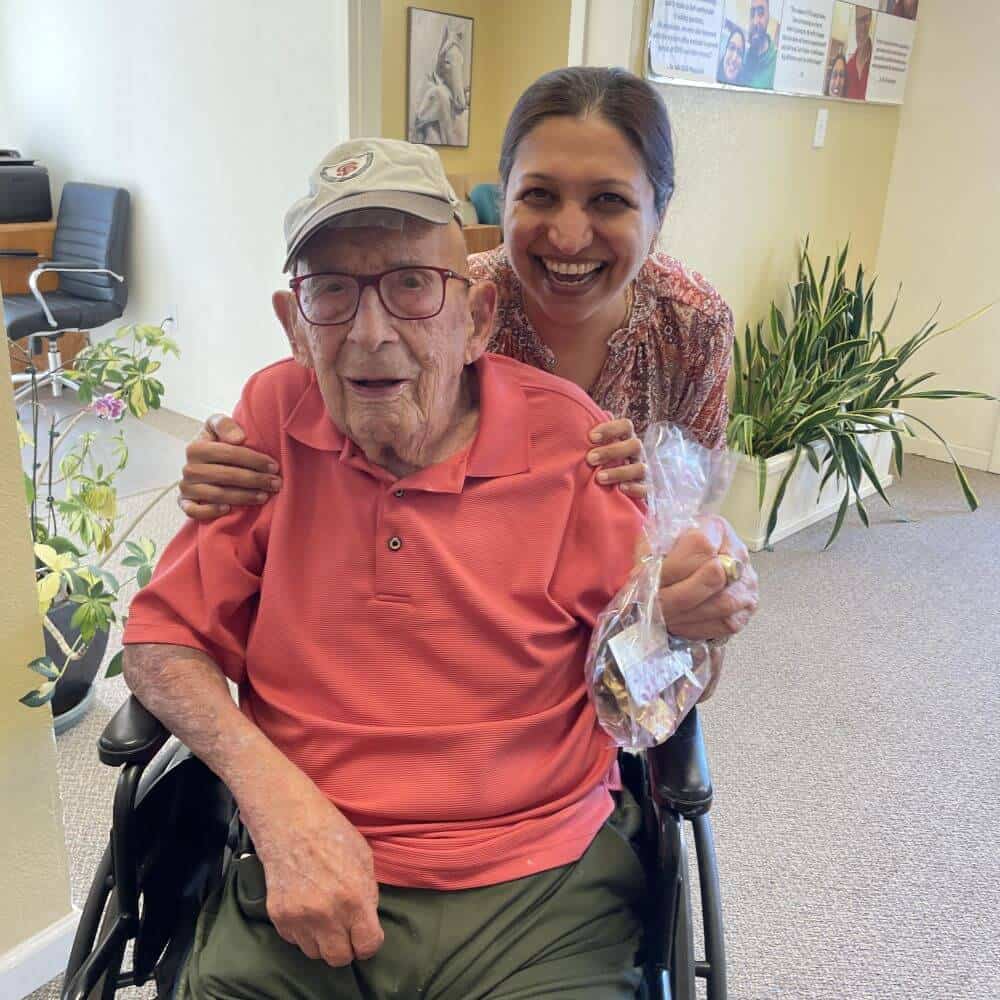Smiling elderly patient with hearing loss and Rina